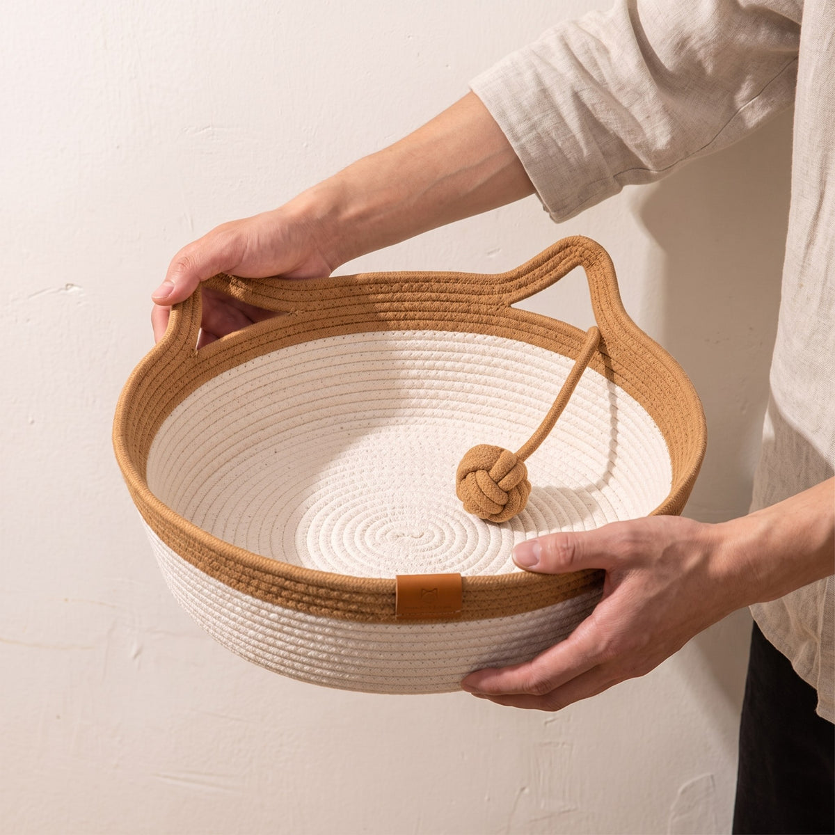 Coiled by hand, one round at a time.